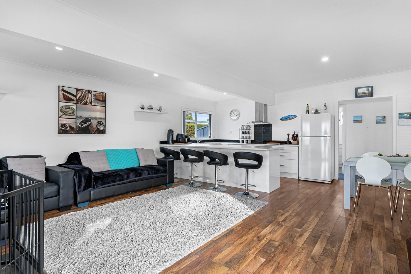 Open-plan living and kitchen with breakfast bar